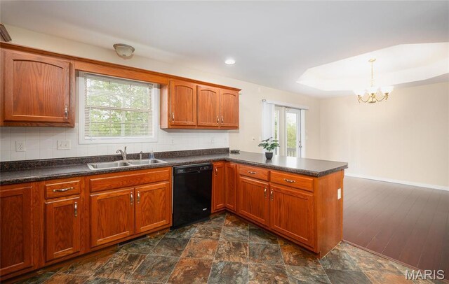 19252 Lambert Ln, Waynesville, MO 65583 - kitchen with a sink, black dishwasher, a peninsula, a chandelier, and dark countertops