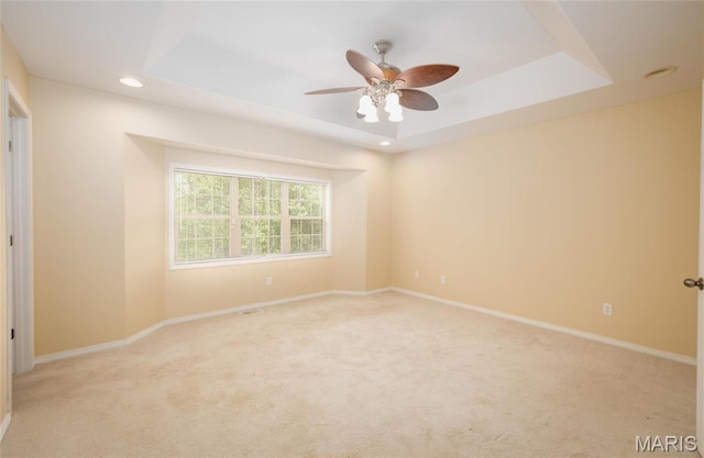 19252 Lambert Ln, Waynesville, MO 65583 - spare room featuring light carpet, a raised ceiling, ceiling fan, baseboards, and recessed lighting