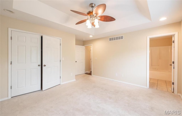 19252 Lambert Ln, Waynesville, MO 65583 - unfurnished bedroom with carpet, baseboards, a tray ceiling, a closet, and recessed lighting