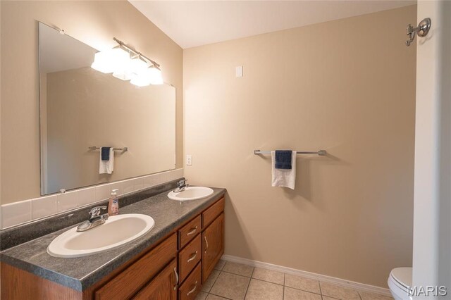 19252 Lambert Ln, Waynesville, MO 65583 - bathroom featuring double vanity, tile patterned flooring, baseboards, and toilet