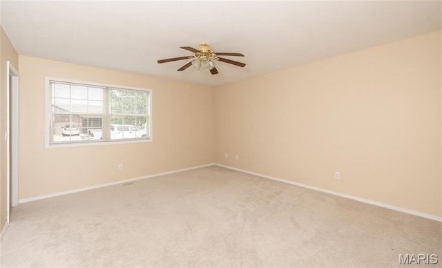 19252 Lambert Ln, Waynesville, MO 65583 - empty room with a ceiling fan, light carpet, and baseboards