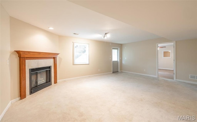 19252 Lambert Ln, Waynesville, MO 65583 - unfurnished living room with light carpet, a fireplace, baseboards, a ceiling fan, and recessed lighting