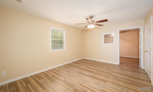 19252 Lambert Ln, Waynesville, MO 65583 - spare room featuring baseboards, ceiling fan, and light wood finished floors