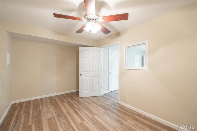 19252 Lambert Ln, Waynesville, MO 65583 - unfurnished bedroom with baseboards, light wood-type flooring, and a ceiling fan