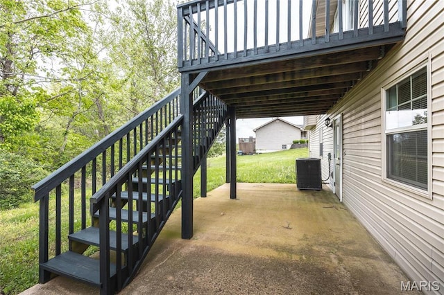 19252 Lambert Ln, Waynesville, MO 65583 - view of patio featuring stairway and central AC unit