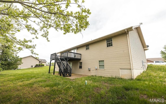 19252 Lambert Ln, Waynesville, MO 65583 - back of house featuring stairs, a deck, and a yard