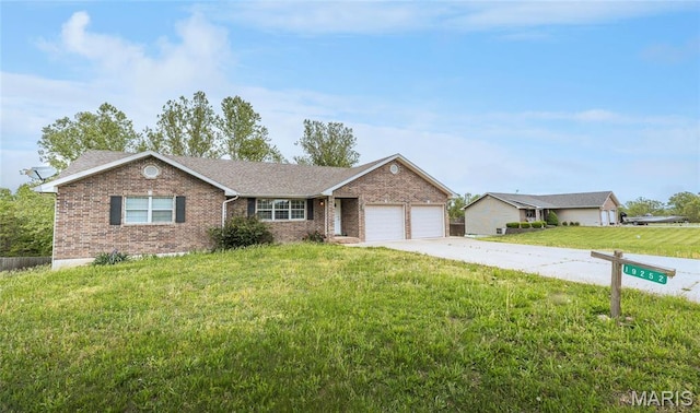 19252 Lambert Ln, Waynesville, MO 65583 - ranch-style home with brick siding, a garage, concrete driveway, a front lawn, and roof with shingles