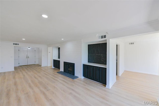 590 Sarah Ln Unit 303, Saint Louis, MO 63141 - unfurnished living room featuring a large fireplace, light wood-style flooring, recessed lighting, a ceiling fan, and baseboards
