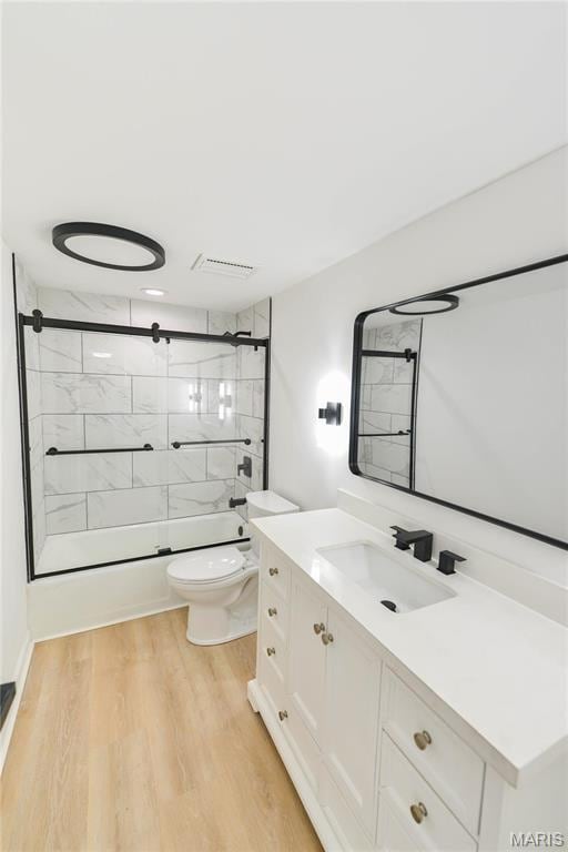 590 Sarah Ln Unit 303, Saint Louis, MO 63141 - bathroom with toilet, vanity, and wood finished floors