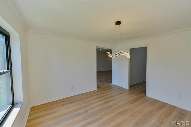 590 Sarah Ln Unit 303, Saint Louis, MO 63141 - unfurnished dining area featuring ornamental molding, light wood-style floors, and baseboards