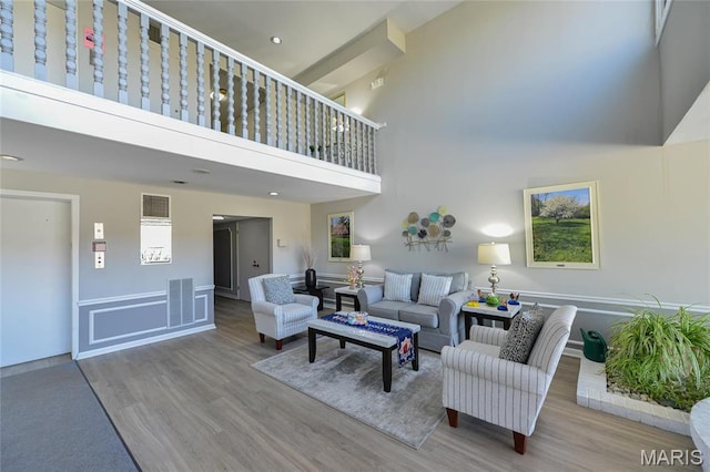 590 Sarah Ln Unit 303, Saint Louis, MO 63141 - living area with a high ceiling, wood finished floors, and recessed lighting