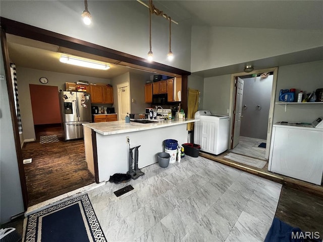 114 S Water St, Truesdale, MO 63380 - kitchen with stainless steel fridge with ice dispenser, brown cabinets, black microwave, a peninsula, and light countertops