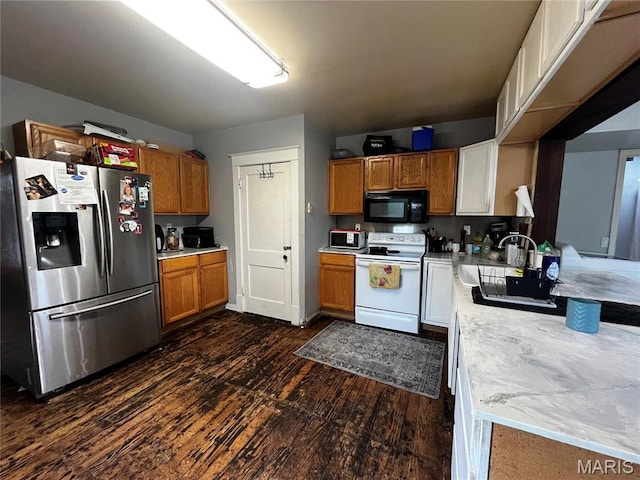 114 S Water St, Truesdale, MO 63380 - kitchen featuring stainless steel fridge, electric stove, black microwave, a sink, and dark wood finished floors
