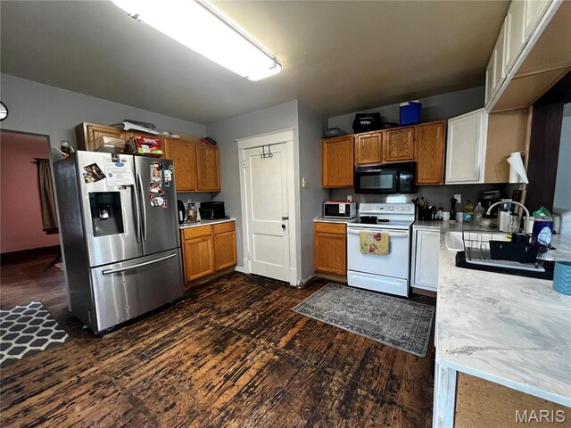 114 S Water St, Truesdale, MO 63380 - kitchen featuring stainless steel fridge with ice dispenser, black microwave, white range with electric cooktop, dark wood-style floors, and brown cabinets