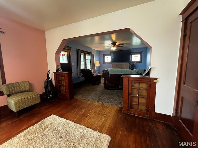 114 S Water St, Truesdale, MO 63380 - living area featuring wood-type flooring, ceiling fan, and baseboards