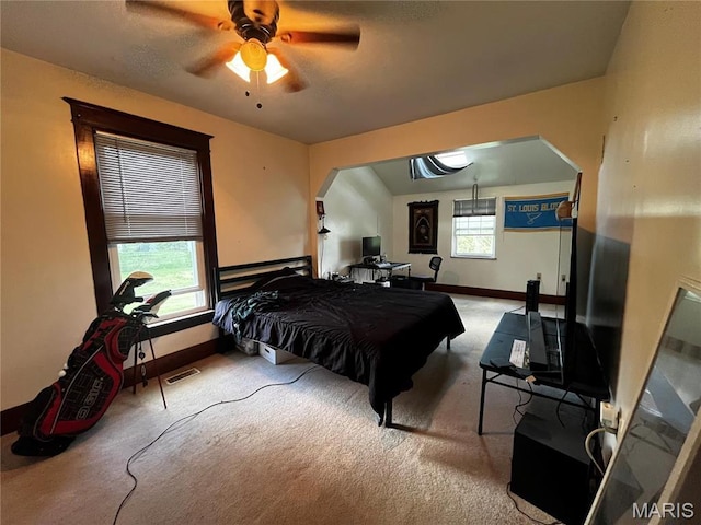 114 S Water St, Truesdale, MO 63380 - carpeted bedroom with arched walkways, baseboards, and a ceiling fan