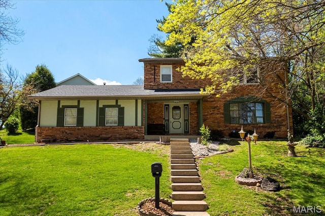 27 Heatherwood Dr, Collinsville, IL 62234 - traditional home featuring a front lawn and brick siding