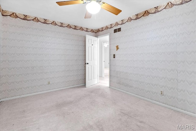 27 Heatherwood Dr, Collinsville, IL 62234 - carpeted empty room with wallpapered walls, ceiling fan, and baseboards