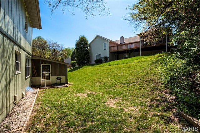 27 Heatherwood Dr, Collinsville, IL 62234 - view of green lawn featuring a sunroom and a deck