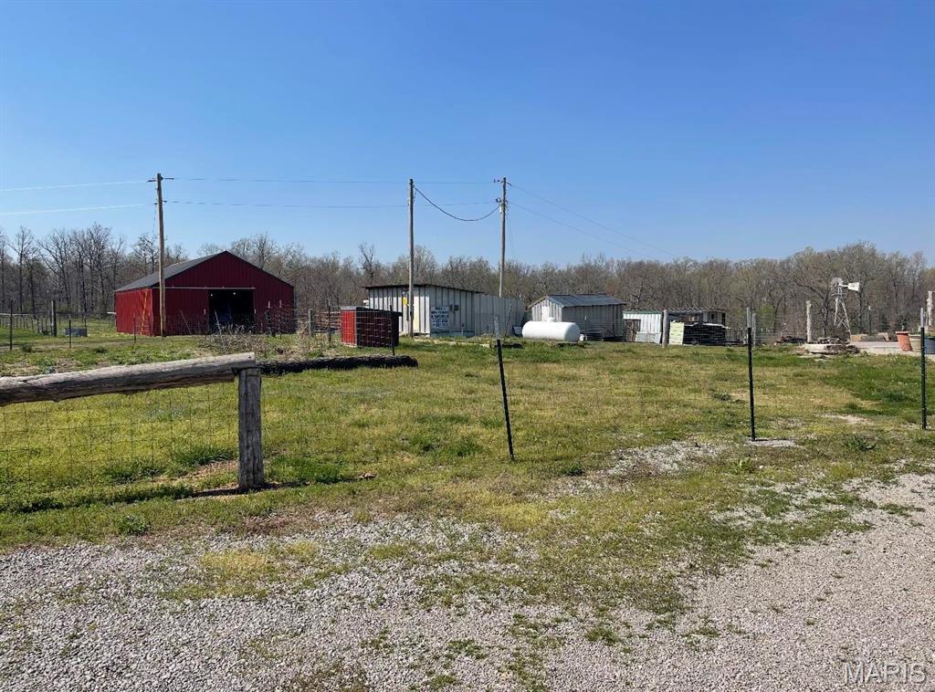 25725 Misty Oak Dr, Lebanon, MO 65536 - view of yard with an outbuilding