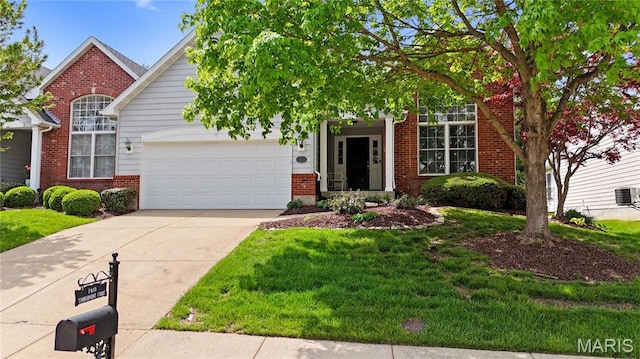 7411 Timberpoint Ct, Fairview Heights, IL 62208 - view of property hidden behind natural elements featuring brick siding, concrete driveway, a garage, and a front yard