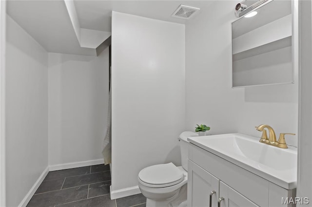 3700 Viking, Saint Louis, MO 63125 - bathroom featuring tile patterned flooring, toilet, vanity, and baseboards