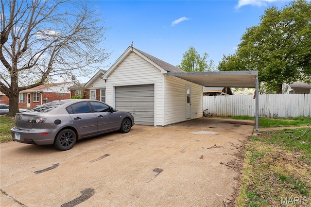 3700 Viking, Saint Louis, MO 63125 - garage with a carport, fence, and concrete driveway