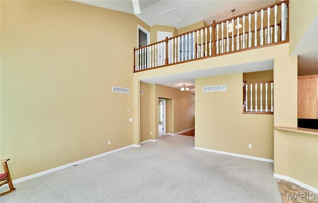 225 River Bluff Ct, Troy, MO 63379 - unfurnished living room featuring baseboards, carpet floors, and high vaulted ceiling