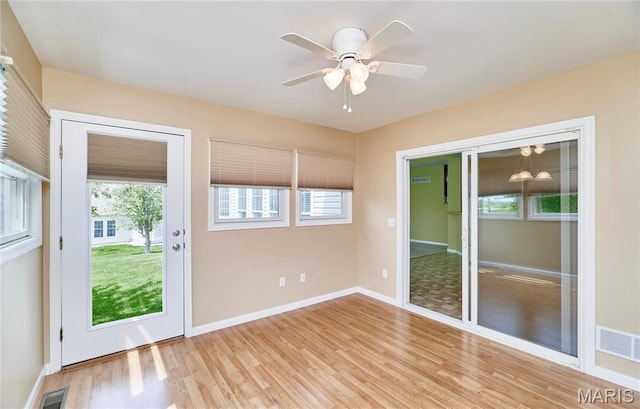 225 River Bluff Ct, Troy, MO 63379 - doorway to outside with plenty of natural light, light wood finished floors, baseboards, and ceiling fan