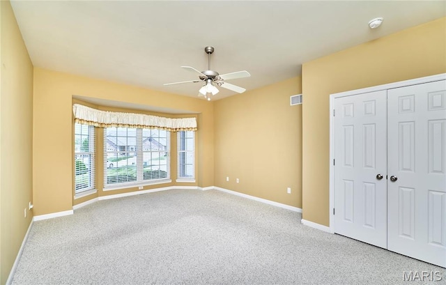 225 River Bluff Ct, Troy, MO 63379 - unfurnished bedroom with carpet, baseboards, a closet, and ceiling fan