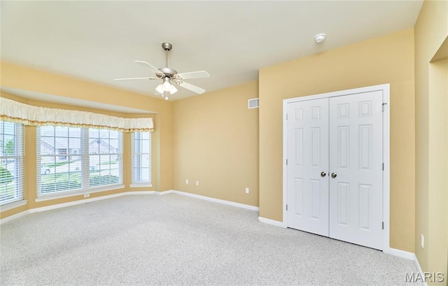 225 River Bluff Ct, Troy, MO 63379 - unfurnished bedroom featuring carpet floors, baseboards, a closet, and a ceiling fan