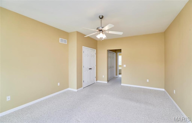 225 River Bluff Ct, Troy, MO 63379 - empty room with ceiling fan, light carpet, and baseboards