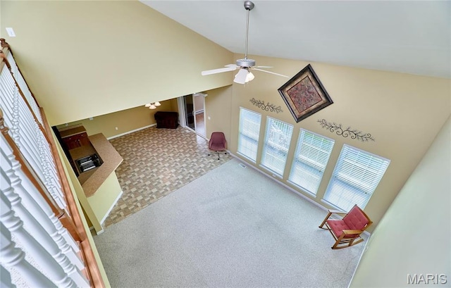 225 River Bluff Ct, Troy, MO 63379 - unfurnished living room with carpet flooring, high vaulted ceiling, and a ceiling fan