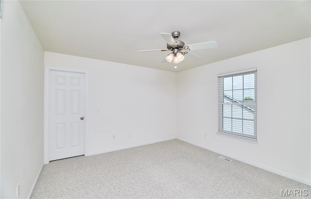 225 River Bluff Ct, Troy, MO 63379 - spare room featuring a ceiling fan, baseboards, and carpet floors