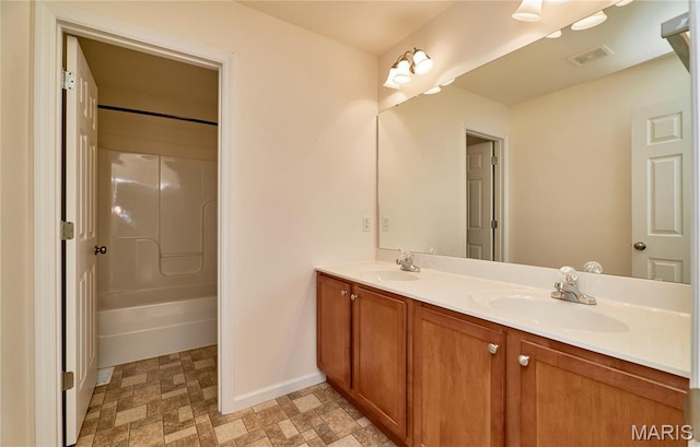 225 River Bluff Ct, Troy, MO 63379 - full bathroom with baseboards, double vanity, and shower / washtub combination