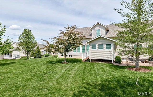 225 River Bluff Ct, Troy, MO 63379 - back of house with roof with shingles and a yard