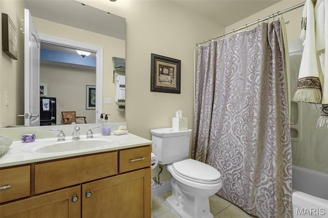 full bathroom with tile patterned floors, toilet, vanity, and shower / bath combo with shower curtain