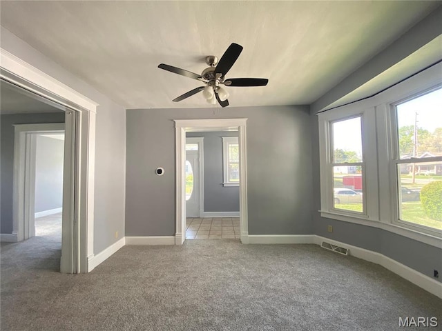 616 N Church St, Belleville, IL 62220 - carpeted empty room with healthy amount of natural light, ceiling fan, and baseboards