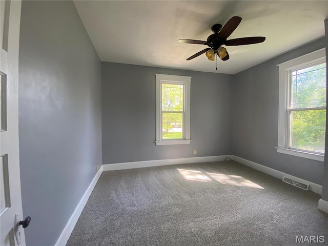 616 N Church St, Belleville, IL 62220 - carpeted spare room featuring baseboards and a ceiling fan
