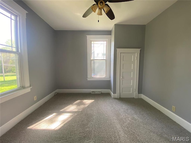 616 N Church St, Belleville, IL 62220 - unfurnished bedroom with carpet floors, baseboards, and ceiling fan