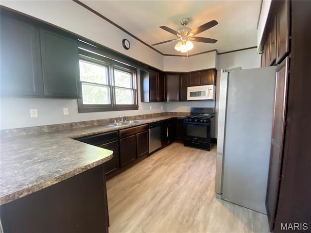 616 N Church St, Belleville, IL 62220 - kitchen with appliances with stainless steel finishes, a sink, ceiling fan, dark brown cabinetry, and dark countertops
