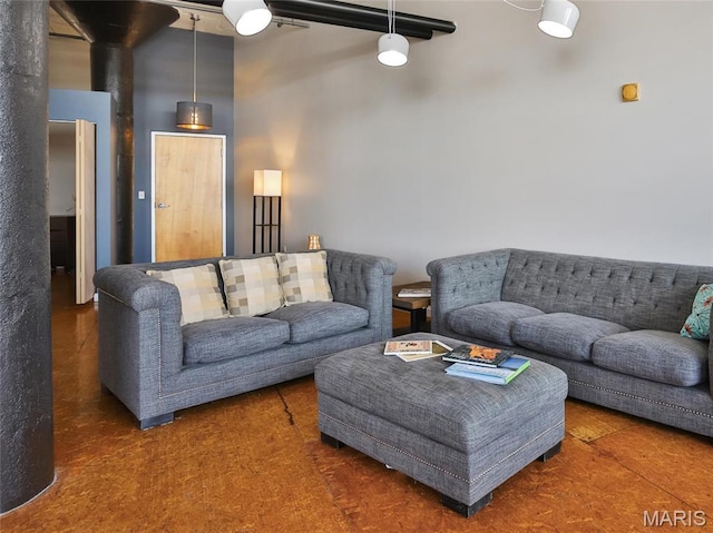 living area with a high ceiling