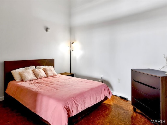 bedroom featuring baseboards and carpet
