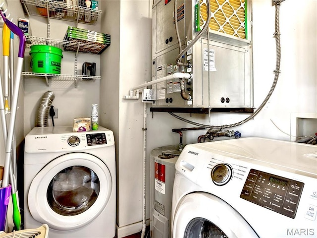 clothes washing area featuring separate washer and dryer