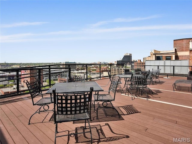wooden deck with outdoor dining space