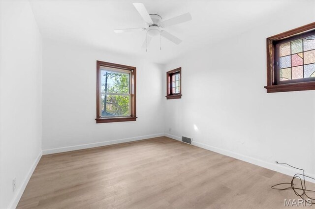5034 Queens Ave, Saint Louis, MO 63115 - spare room featuring light wood finished floors, baseboards, and a ceiling fan