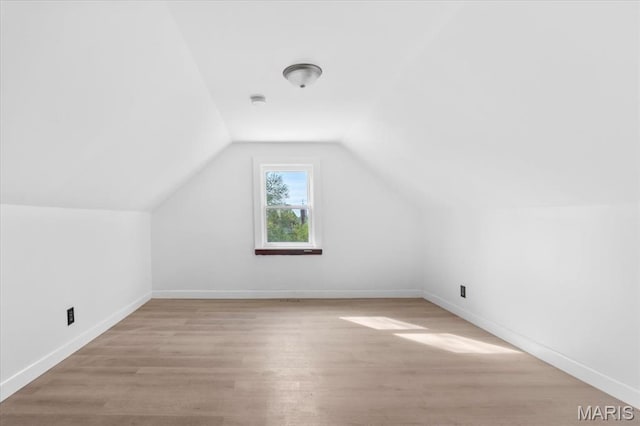 5034 Queens Ave, Saint Louis, MO 63115 - additional living space featuring light wood-style flooring, vaulted ceiling, and baseboards