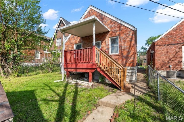 5034 Queens Ave, Saint Louis, MO 63115 - rear view of property with brick siding, central AC unit, and a deck