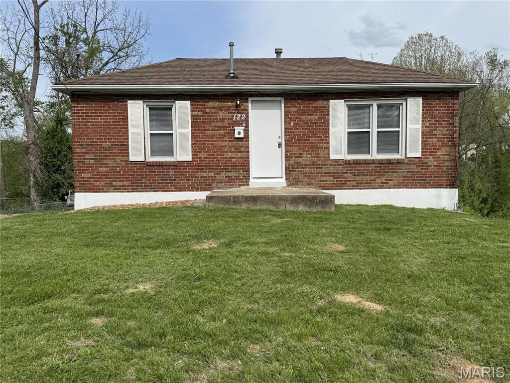 122 Moffett Ave, Collinsville, IL 62234 - back of property with brick siding, a lawn, and roof with shingles