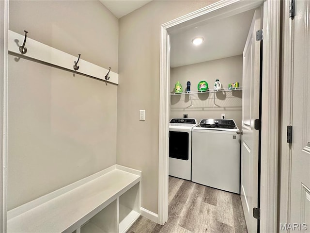 3553 Chippewa Dr, Shiloh, IL 62221 - laundry room with washer and clothes dryer, light wood-style flooring, and baseboards